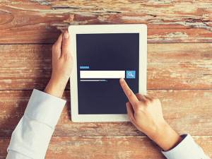 Woman on a tablet computer about to input an internet search